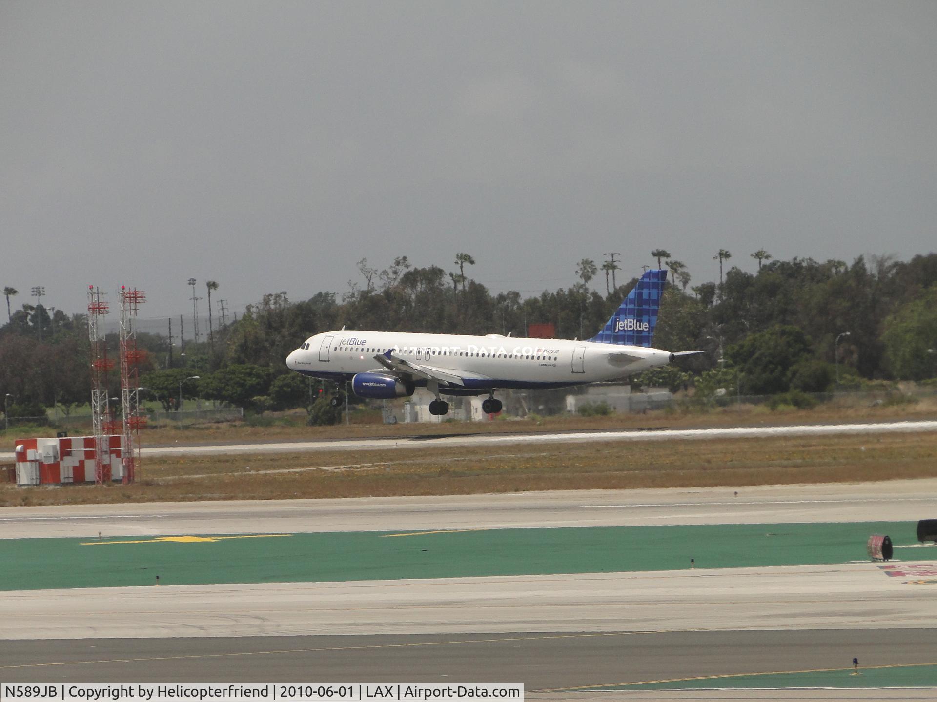 N589JB, 2004 Airbus A320-232 C/N 2215, Landing runway 24R