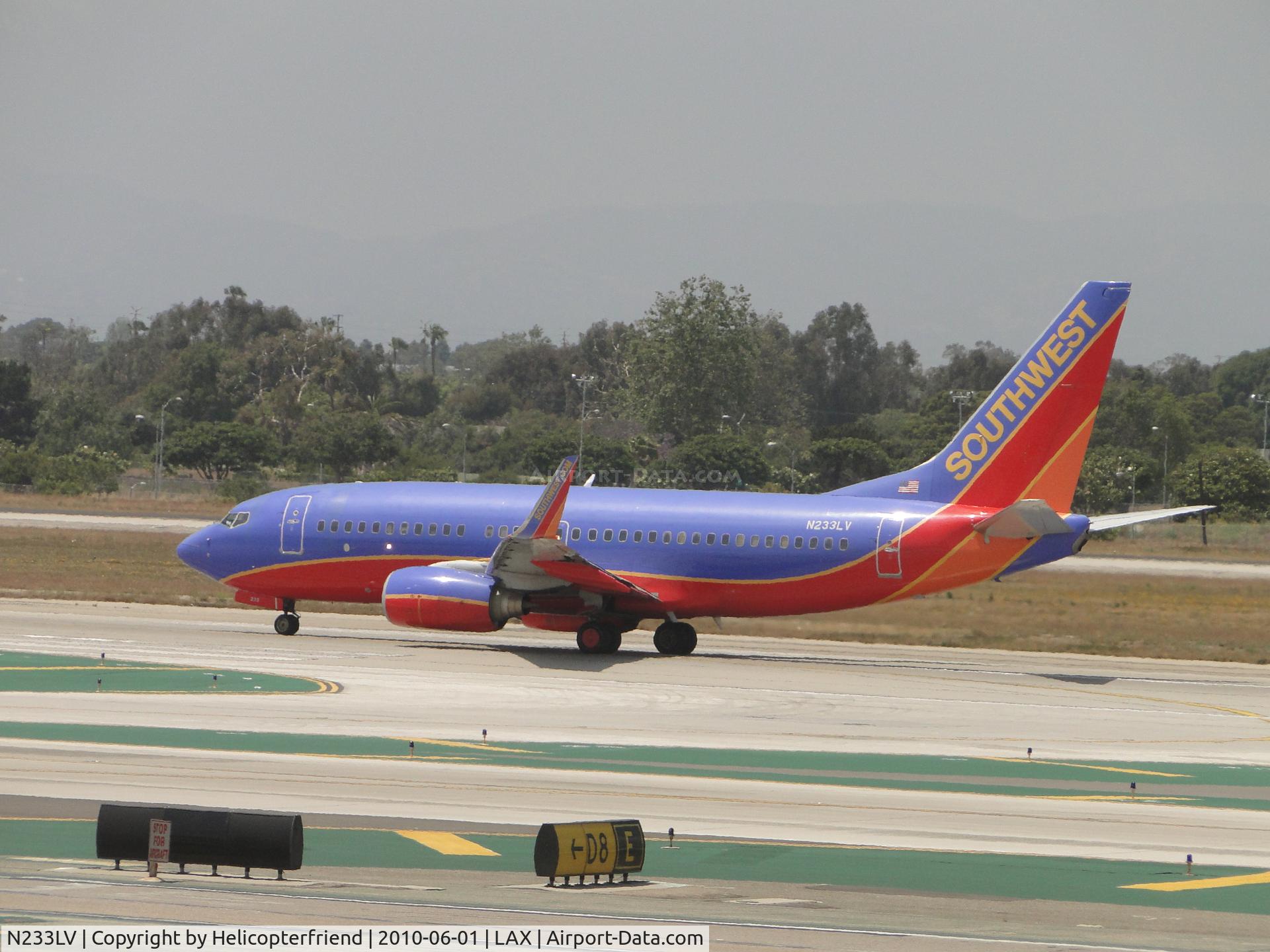 N233LV, 2006 Boeing 737-7H4 C/N 32501, Starting take off roll on runway 24L