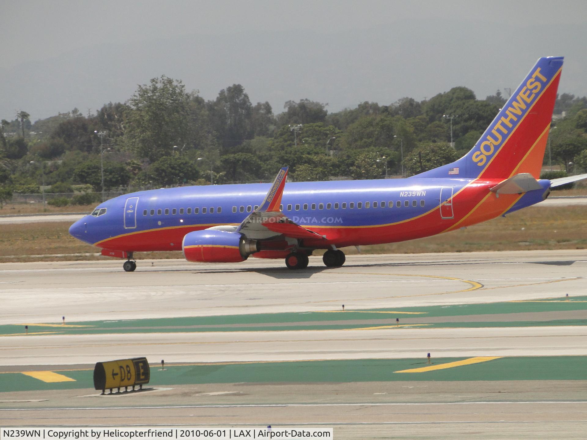 N239WN, 2006 Boeing 737-7H4 C/N 34714, Starting roll out for take off westbound on 24L