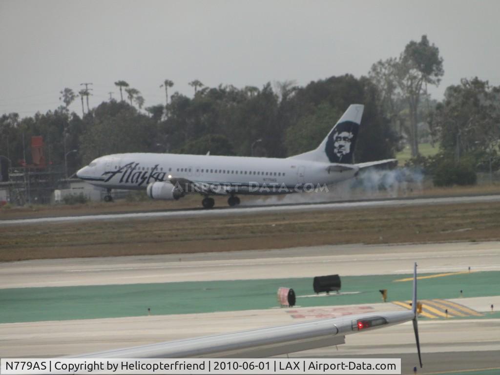 N779AS, 1994 Boeing 737-4Q8 C/N 25111, Smoking the tires on landing on 24R