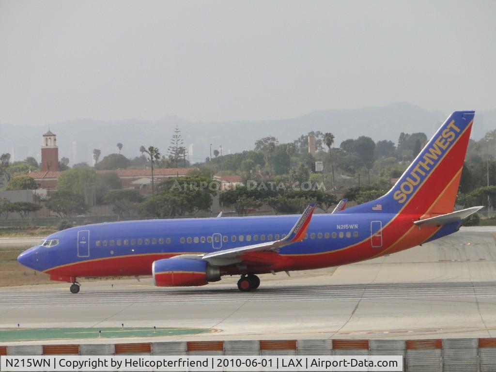N215WN, 2005 Boeing 737-7H4 C/N 32487, Starting take off roll 24L