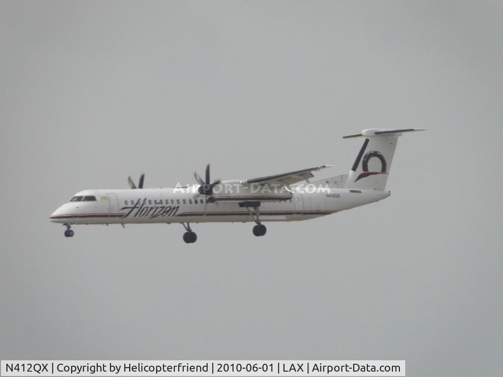 N412QX, 2002 Bombardier DHC-8-402 Dash 8 C/N 4059, Landing 24R