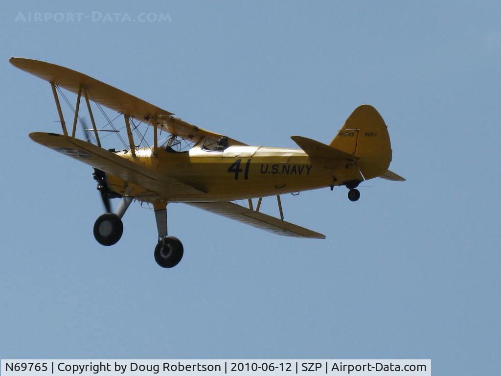 N69765, 1941 Boeing A75N1 (PT17) C/N 75-1044, 1941 Boeing Stearman A75N1 as Navy N2-S1, Continental W670 220 Hp, takeoff climb Rwy 22