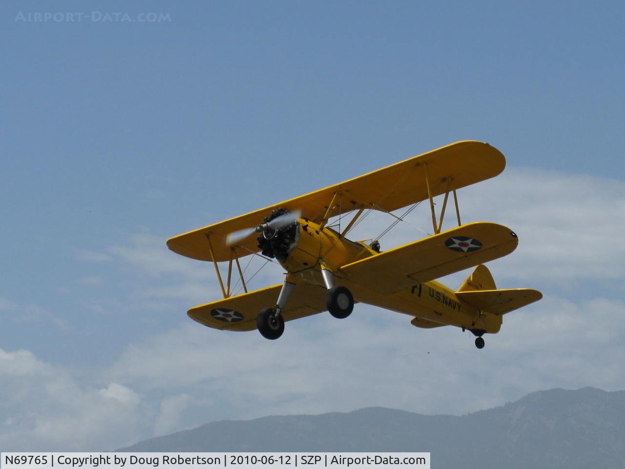 N69765, 1941 Boeing A75N1 (PT17) C/N 75-1044, 1941 Boeing Stearman A75N1 as Navy N2-S1, Continental W670 220 Hp, takeoff climb Rwy 22