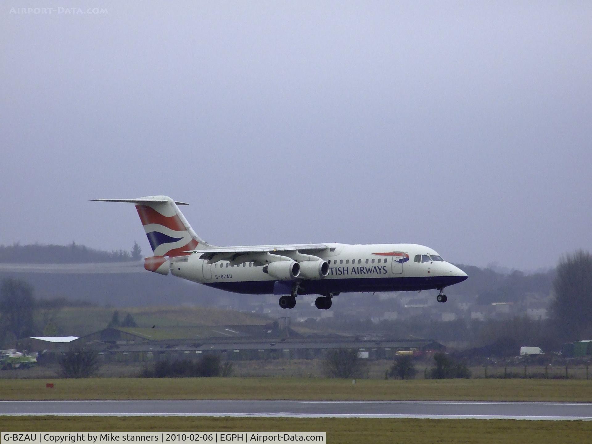 G-BZAU, 1998 British Aerospace Avro 146-RJ100 C/N E3328, BA RJ100 Landing on runway 06, pulling long vortices from the flaps and air brake due to the very damp conditions at EDI Today