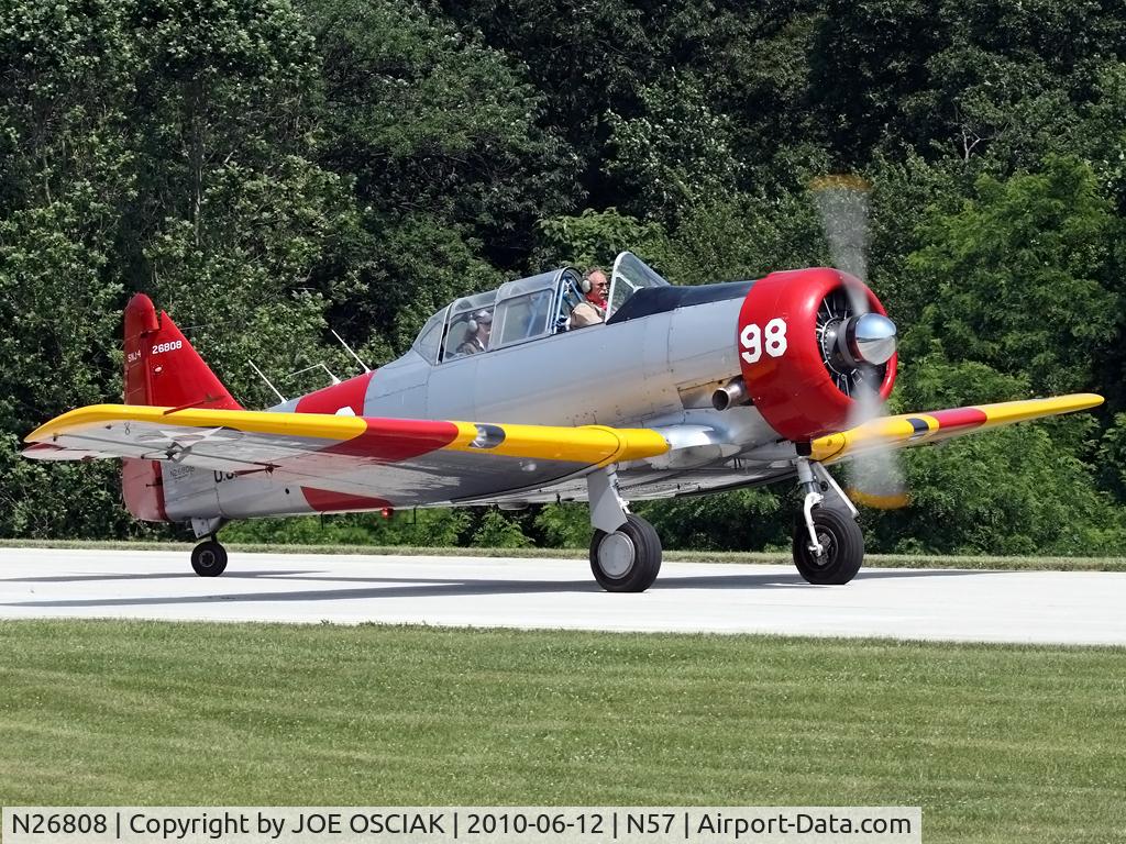 N26808, 1956 North American SNJ-4 Texan C/N 88-11452, leaving New Garden