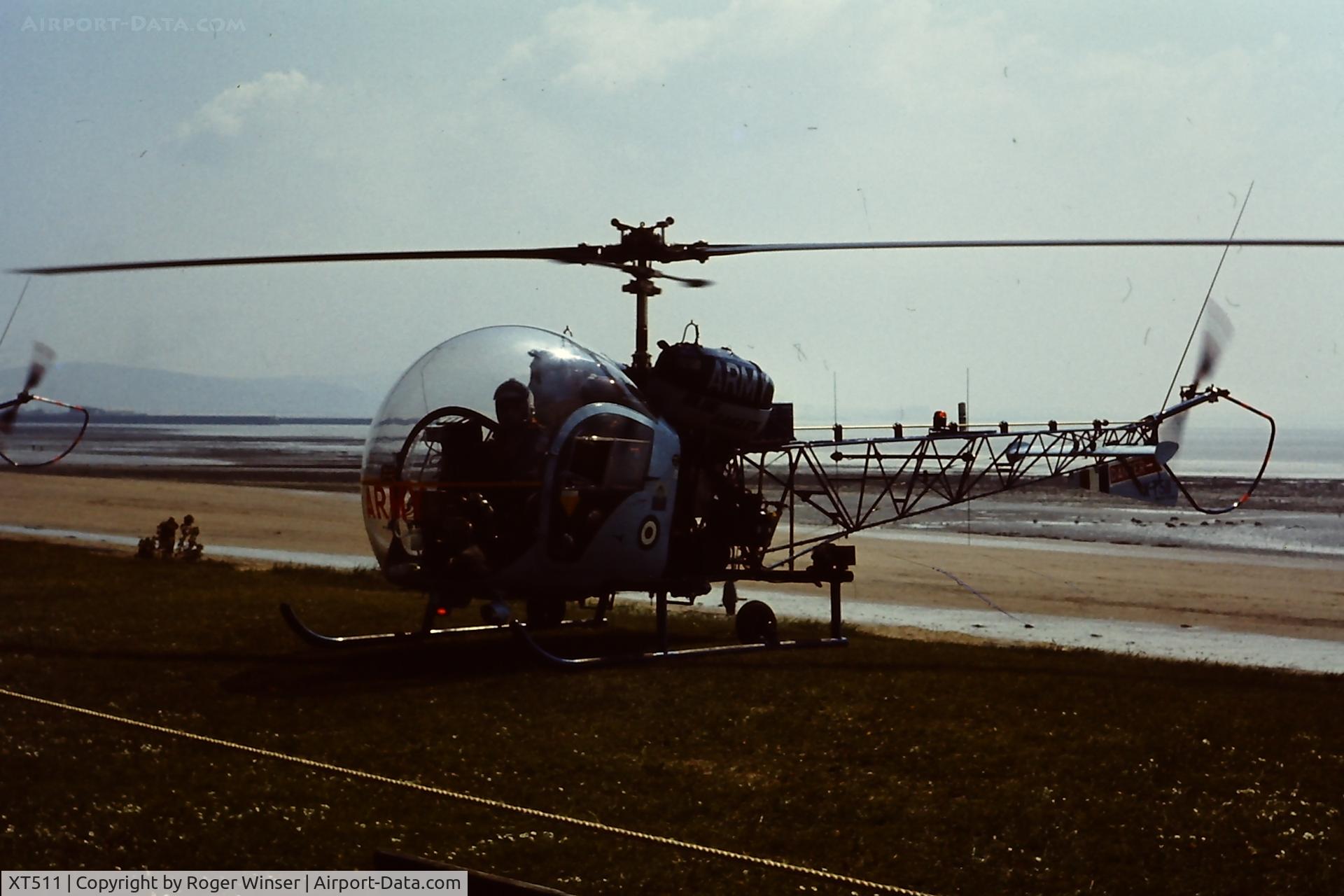 XT511, 1966 Westland Sioux AH.1 C/N WA423, Off airport. Sioux of the Army Air Corps Blue Eagles helicopter display team at the Swansea Bay Airshow, Wales early 1970's