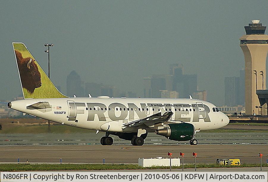 N806FR, 2004 Airbus A318-111 C/N 2218, Departing 18L at DFW.  Downtown Dallas 15 miles distant.
