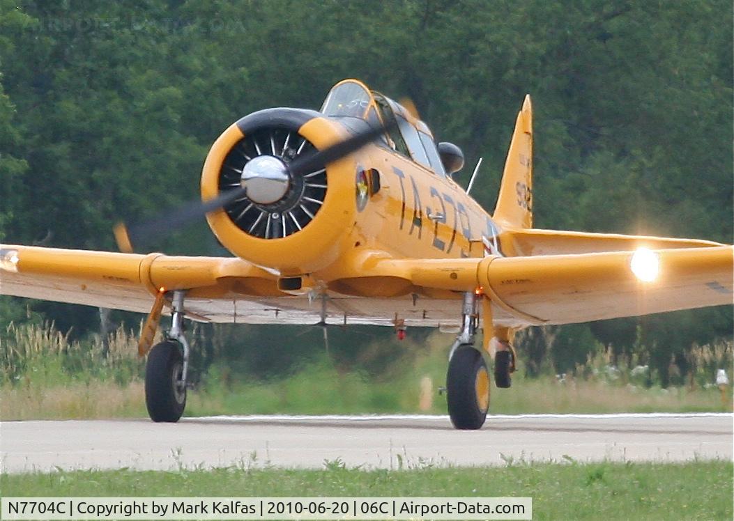 N7704C, 1949 North American T-6G Texan C/N 168-383, North American T-6G, departing RWY 11 06C (Schaumburg, IL).