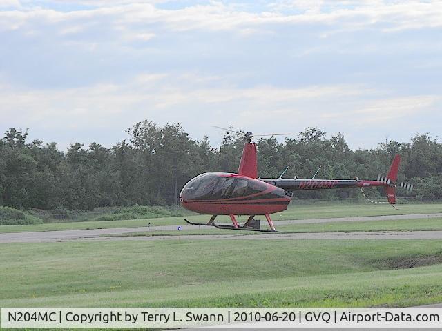 N204MC, Robinson R44 II C/N 12596, Hovering getting ready to park for breakfast.