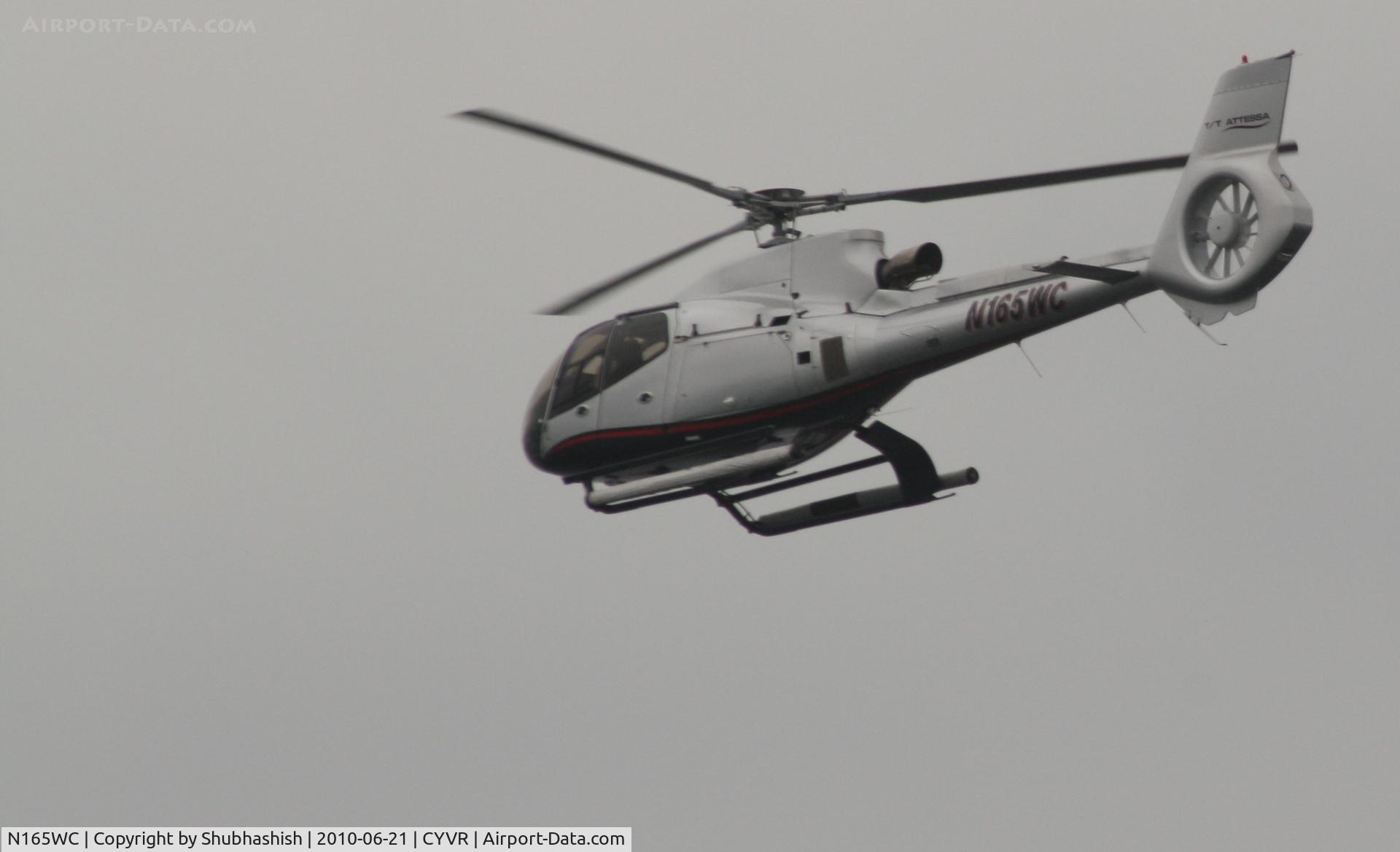 N165WC, 2004 Eurocopter EC-130B-4 (AS-350B-4) C/N 3860, Helicopter taking off near the Canada Place building , Near Vancouver down town