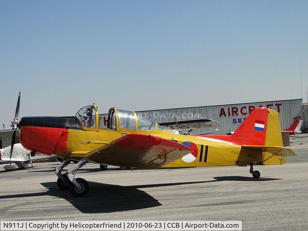 N911J, 1986 Fokker S-11-1 C/N E-11, Parked in front of Maniac Mike's