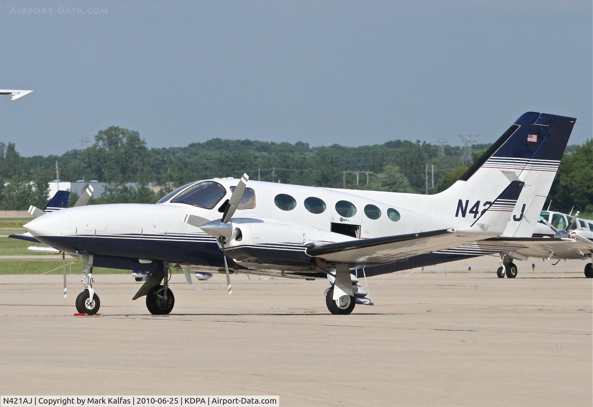 N421AJ, Cessna 421C Golden Eagle C/N 421C0637, 1ST PARTNERS & CO INC, Cessna 421C Golden Eagle N421AJ on the ramp KDPA on a quick turn from KADS (Addison, TX).