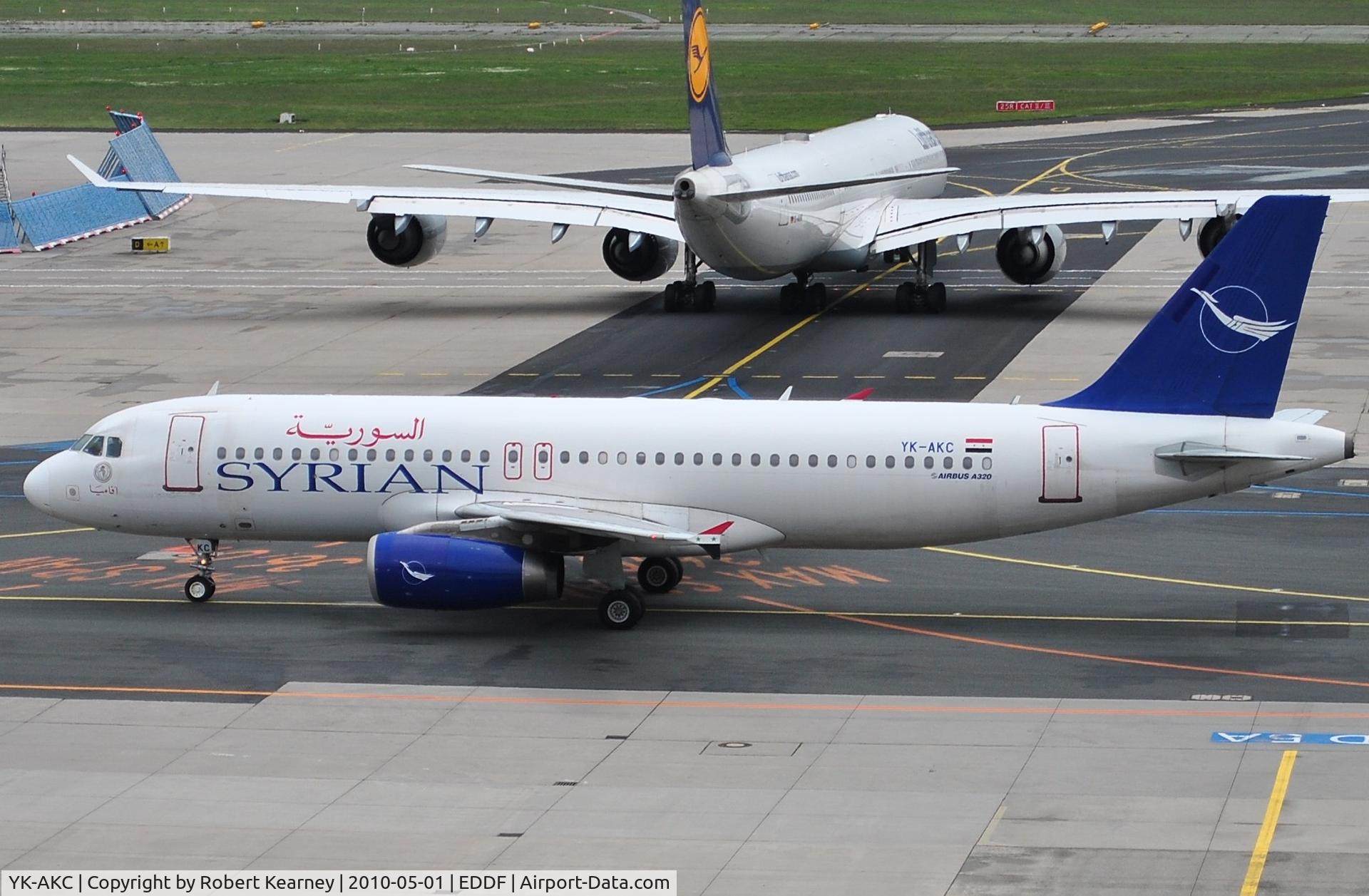 YK-AKC, 1999 Airbus A320-232 C/N 1032, Syrian heading to stand with a long-haul preparing to leave behind it