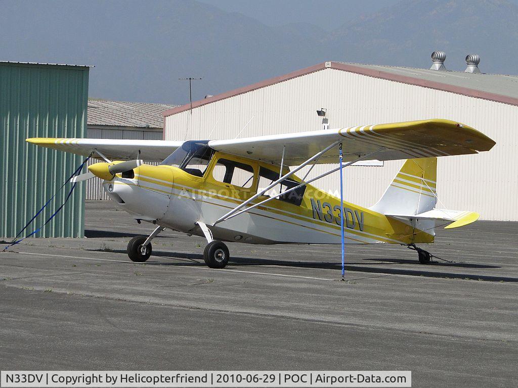N33DV, 1970 Champion 7GCBC C/N 234-70, Tied down and parked next to portable hangers