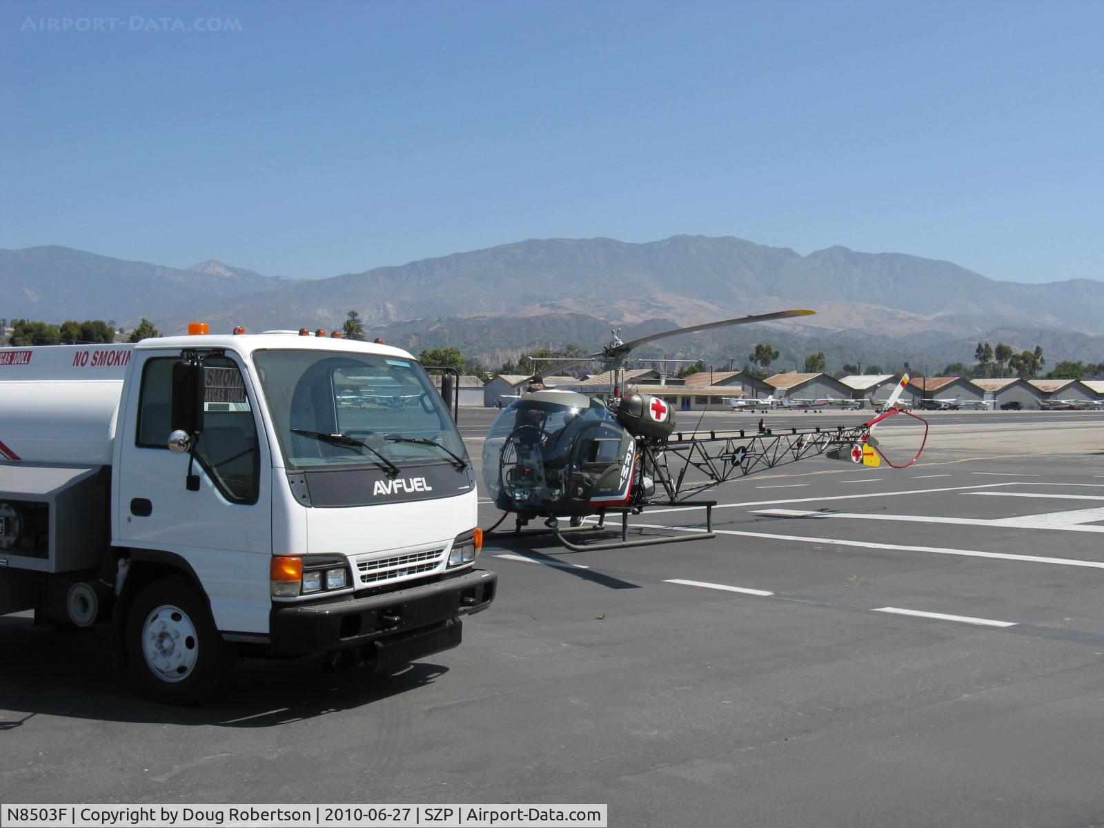 N8503F, 1965 Bell 47G-4 C/N 3350, 1965 Bell 47G, Lycoming VO-540 305 Hp, refueling from the AVFUEL truck at the helipad.