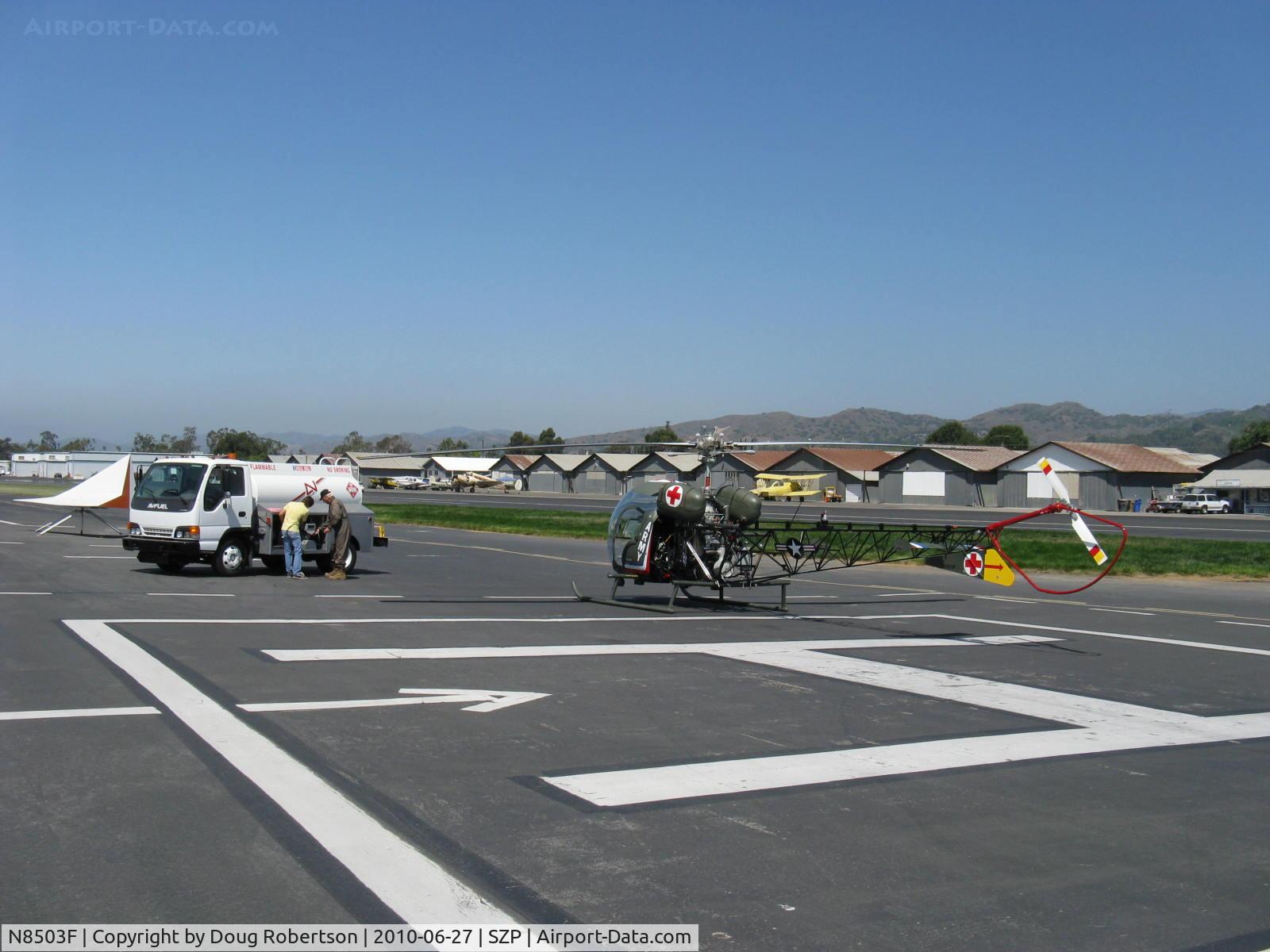 N8503F, 1965 Bell 47G-4 C/N 3350, 1965 Bell 47G, Lycoming VO-540 305 Hp, refueling from the AVFUEL truck at the helipad