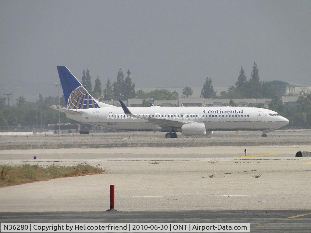 N36280, 2003 Boeing 737-824 C/N 31598, Rolled out from landing on runway 26R and now taxiing back to Terminal