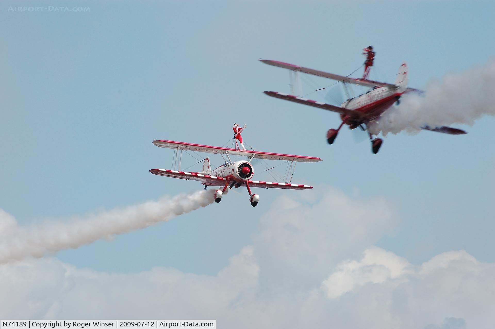 N74189, 1941 Boeing PT-17/R985 Kaydet (A75N1) C/N 75-717, Off airport. Deux/2 with trois/3 (N707TJ) of Team Guinot during a close pass at the Wales National Airshow, Swansea Bay, Wales, UK in July 2009.