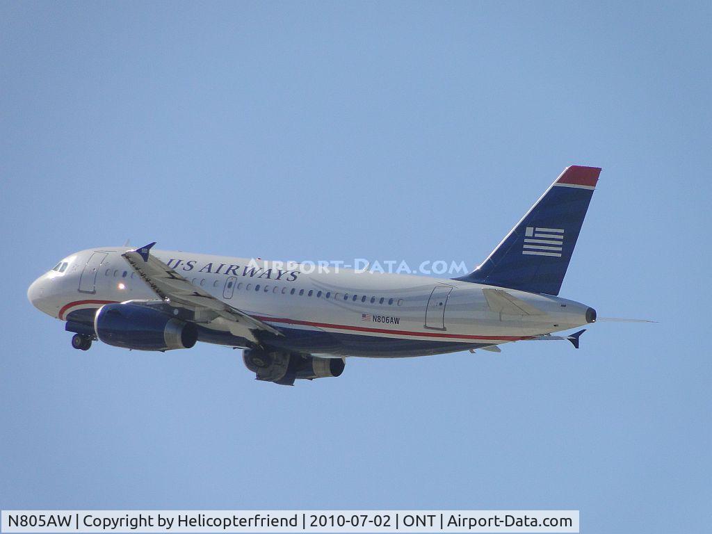 N805AW, 1999 Airbus A319-132 C/N 1049, Wheels coming up after take off from runway 26R and heading west