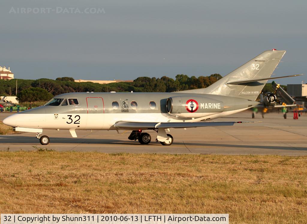 32, 1974 Dassault Falcon 10MER C/N 32, Departing from LFTH Open Day 2010 with special logo on fuselage only on left side...