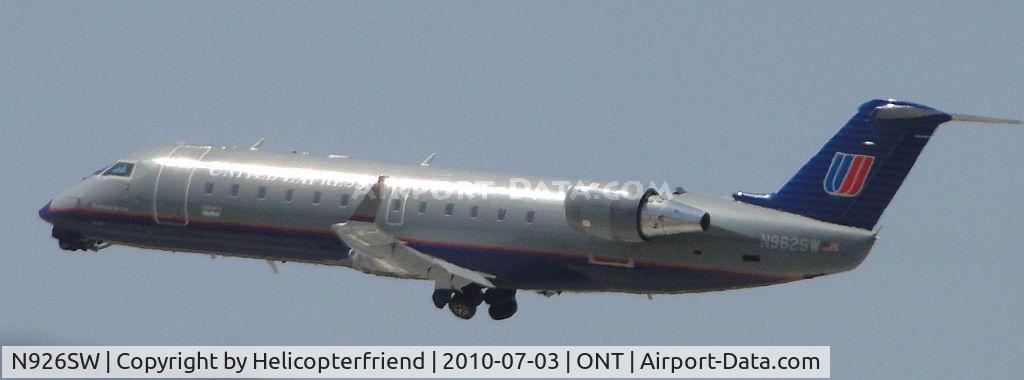 N926SW, 2002 Bombardier CRJ-200LR (CL-600-2B19) C/N 7687, Taking off westbound from 26R