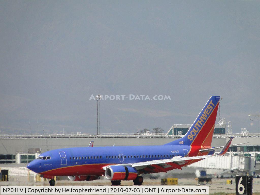 N201LV, 2005 Boeing 737-7H4 C/N 29854, Rolling out after landing on runway 26R and preparing to taxi back to terminal