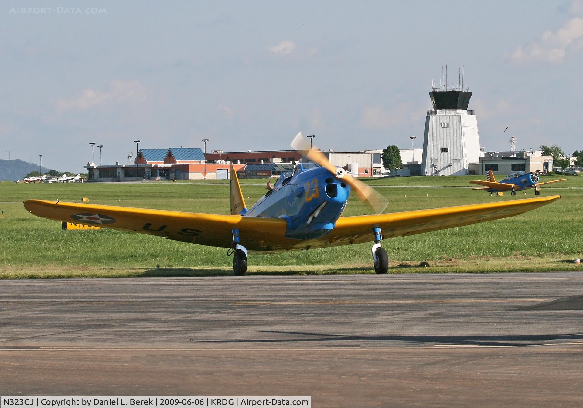 N323CJ, 1943 Fairchild M-62A C/N T43-5778, Contact! Michael Lehnart starts up his beautifully restored PT-19 to take another lucky traveler up for a scenic ride, while a Vultee Valiant BT-13 taxies in duriing the MAAM World War II Weekend.