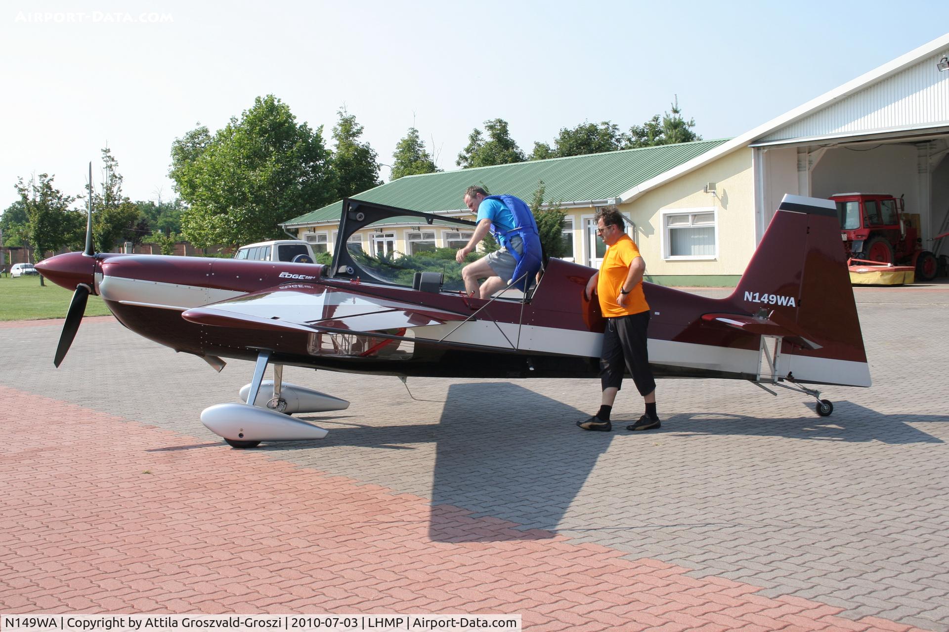 N149WA, Zivko Edge 540T C/N 2021, Kecskemét-Matkó Airport, Hungary. Boarding into the airplane.