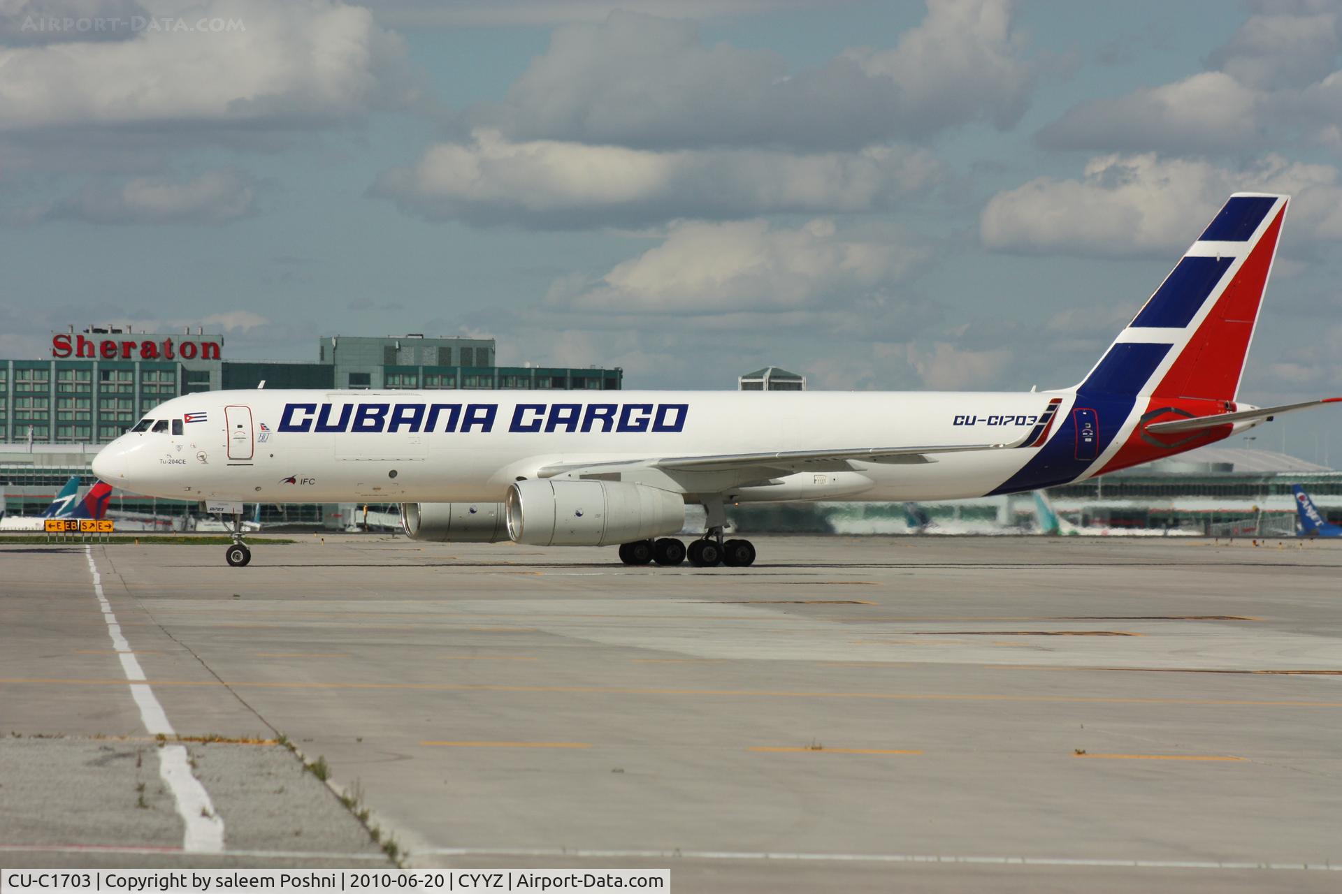 CU-C1703, 2008 Tupolev Tu-204CE C/N 145074-64037, Cubana Cargo taxing to cargo terminal beside U.S.A.F C17