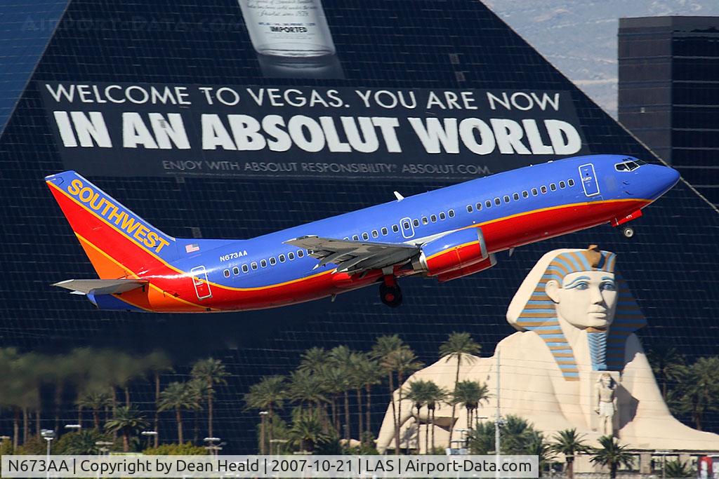 N673AA, 1985 Boeing 737-3A4 C/N 23251, Southwest Airlines N673AA (FLT SWA2041) climbing out from RWY 1R, passing in front of the Luxor Hotel & Casino, enroute to Albuquerque International Sunport Airport (KABQ).