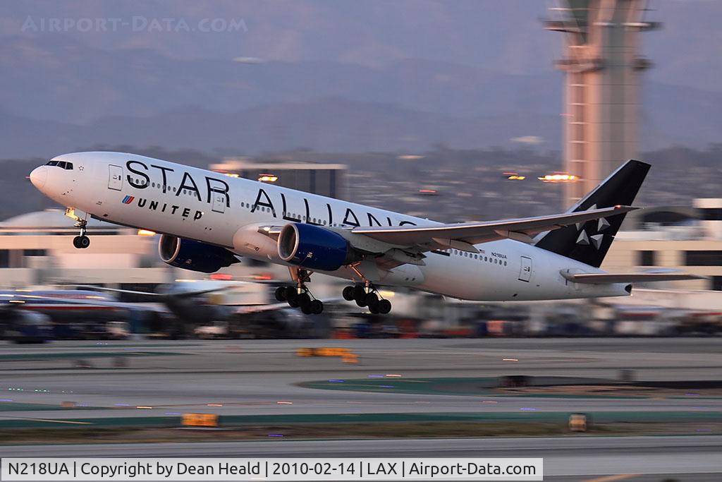 N218UA, 2001 Boeing 777-222 C/N 30222, United Airlines N218UA departing departing RWY 25R late in the day. (1/60 sec).