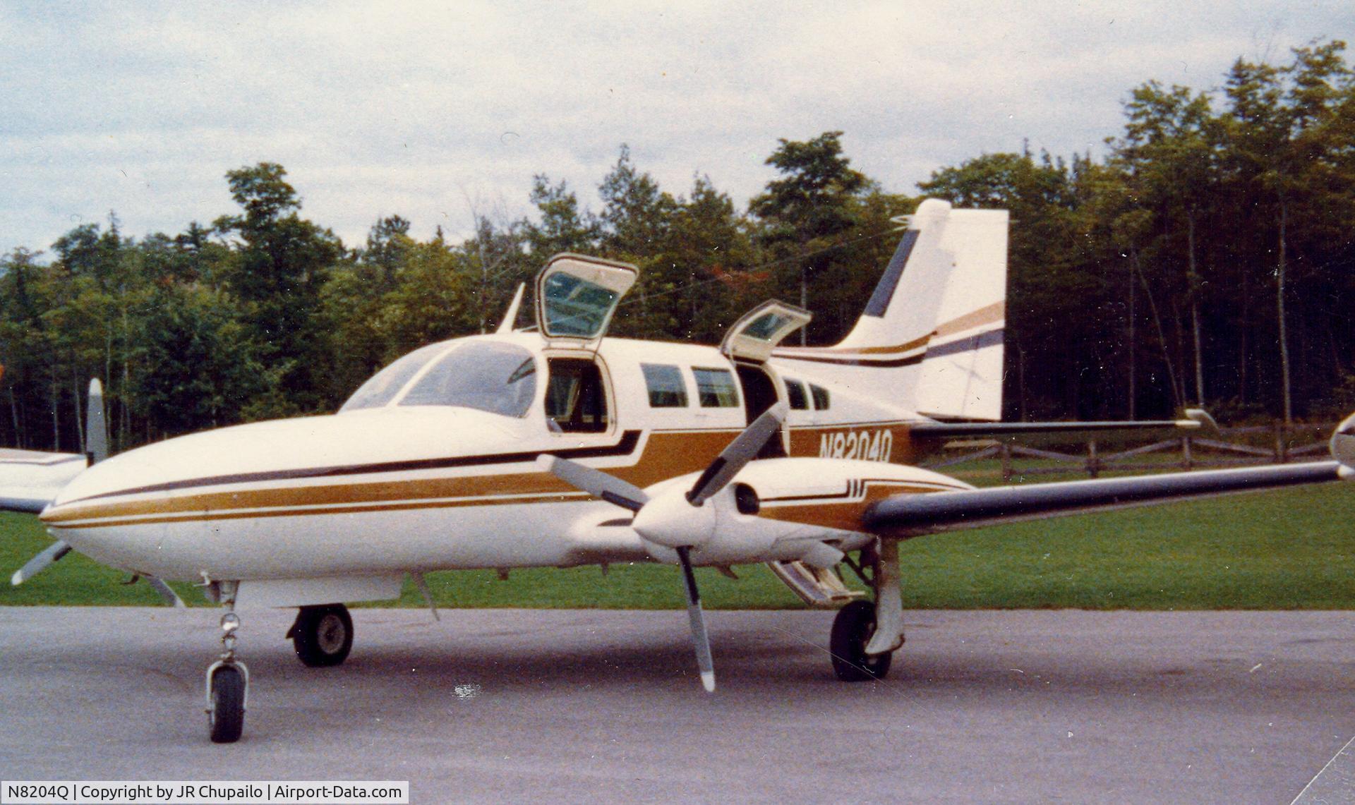 N8204Q, Cessna 402B C/N 402B0384, N8204Q at Mackinac Island Airport 1980.