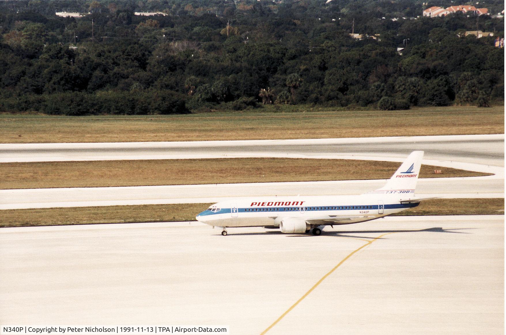 N340P, 1987 Boeing 737-301 C/N 23556, Piedmont Air Lines Boeing 737-301 taxying to the terminal at Tampa in November 1991.