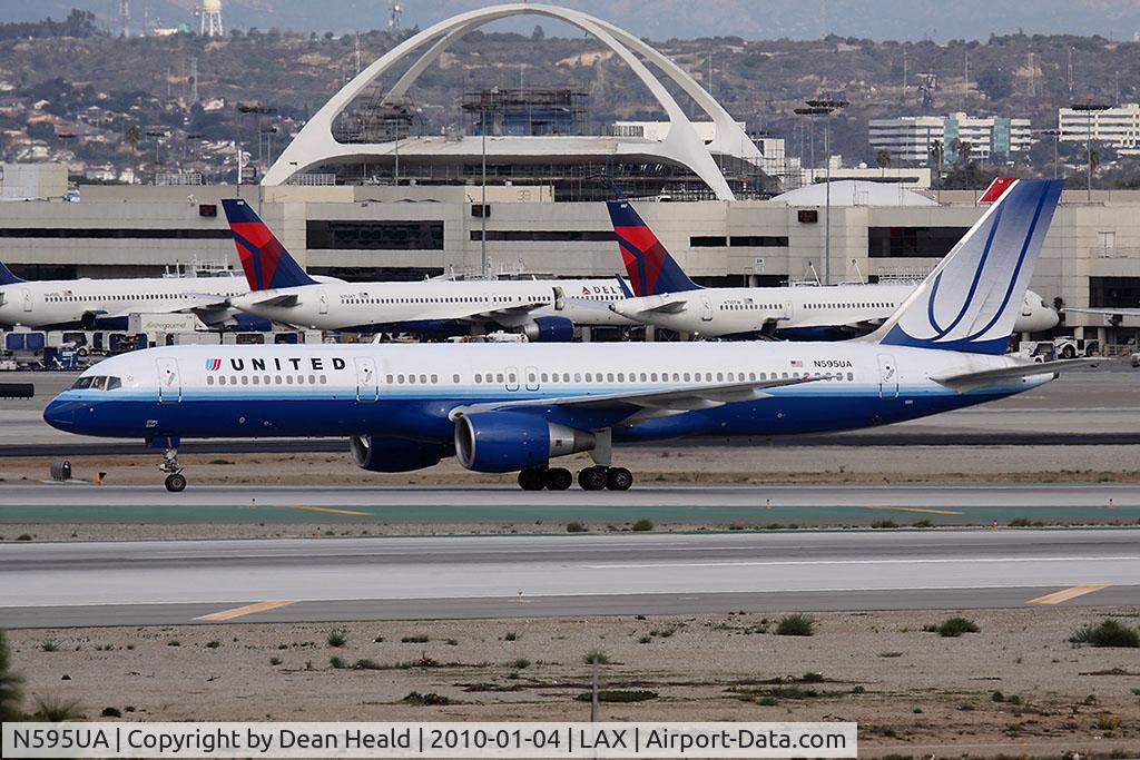 N595UA, 1998 Boeing 757-222 C/N 28748, United Airlines N595UA (FLT UAL817) on the center taxiway after arrival from San Francisco Int'l (KSFO) on RWY 25L.