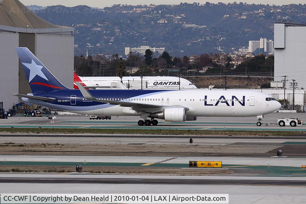 CC-CWF, 2006 Boeing 767-316/ER C/N 34626, LAN Airlines CC-CWF being towed from the west remote gates to the Tom Bradley International Terminal. A Qantas A-380, VH-OQA, is in the background.