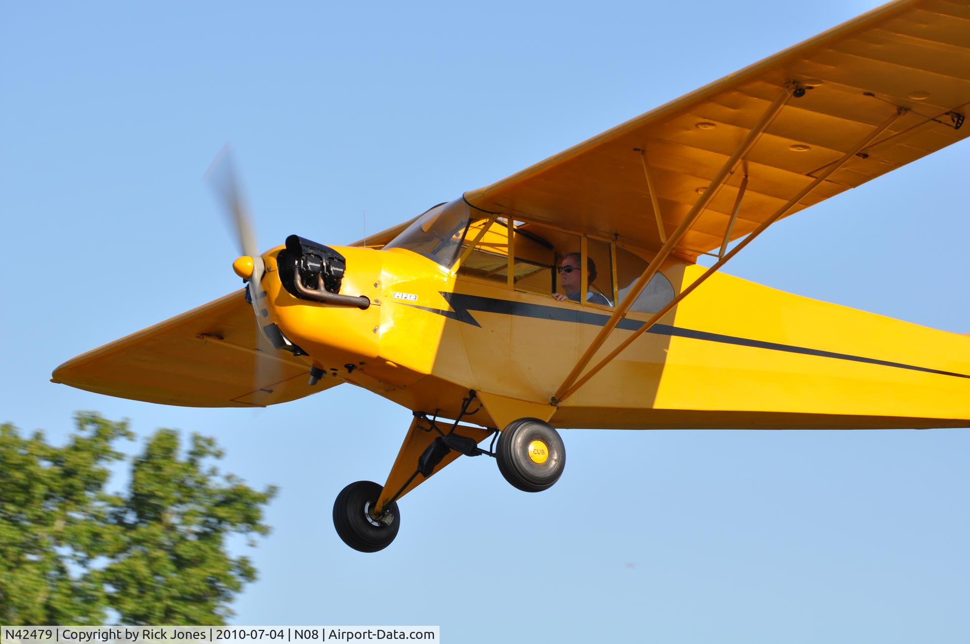 N42479, 1945 Piper J3C-65 Cub Cub C/N 14748, J3 returning after a July 4th celebration fly-over.