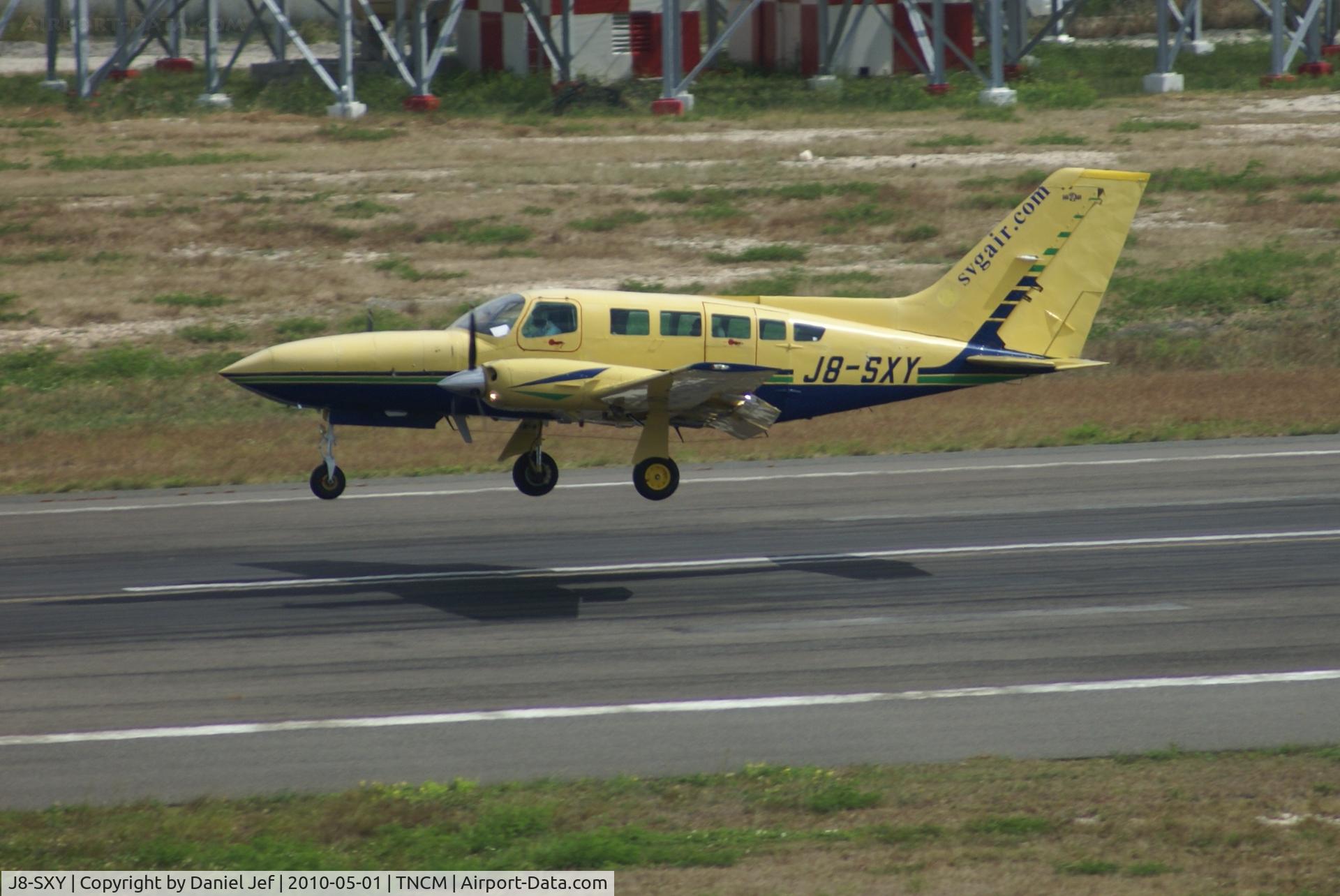 J8-SXY, Cessna 402C C/N 402C-0519, J8-SXY landing at TNCM runway 10