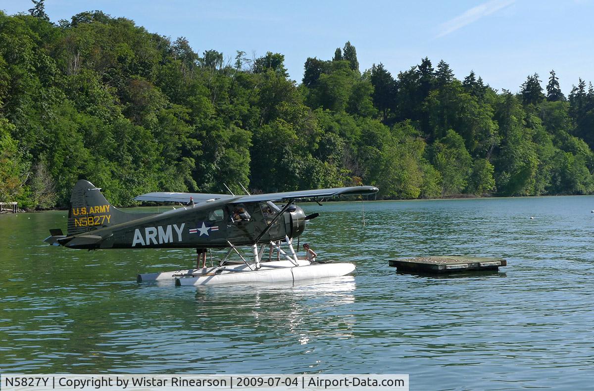N5827Y, 1956 De Havilland Canada U-6A Beaver C/N 932, This magnificent Beaver landed in Vashon Island's Quartermaster Harbor and taxied near to shore. A young couple in a canoe paddled out to pick up the pilot.