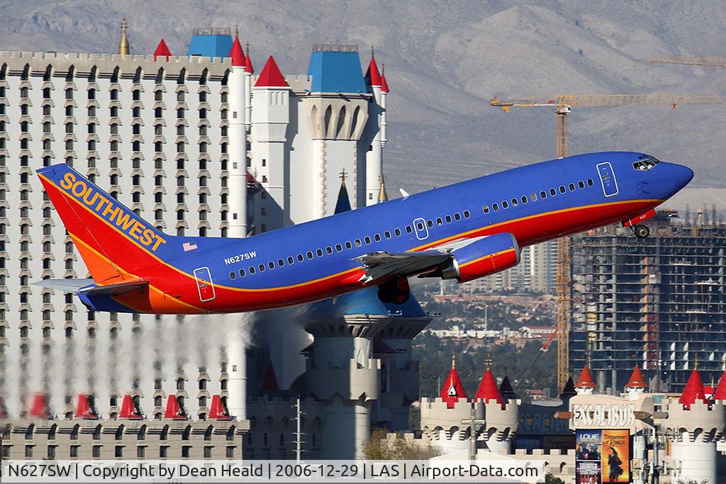 N627SW, 1996 Boeing 737-3H4 C/N 27935, Southwest Airlines N627SW (FLT SWA1789) climbing out from RWY 1R, in front of the Excalibur Hotel, enroute to Ontario Int'l Airport (KONT).