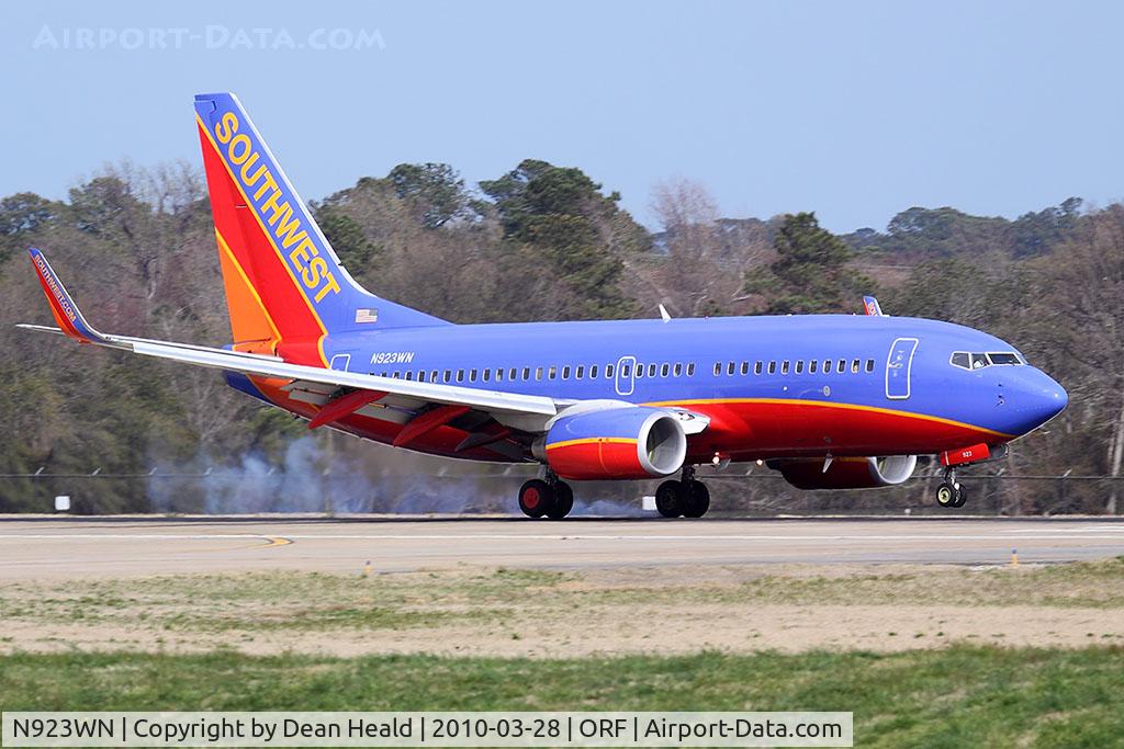 N923WN, 2008 Boeing 737-7H4 C/N 36627, Southwest Airlines N923WN (FLT SWA254) from Tampa Int'l (KTPA) landing RWY 23 in strong crosswind conditions. You can see than he has right rudder applied and I'm sure left aileron as well, as the plane touches down on the left main gear first.