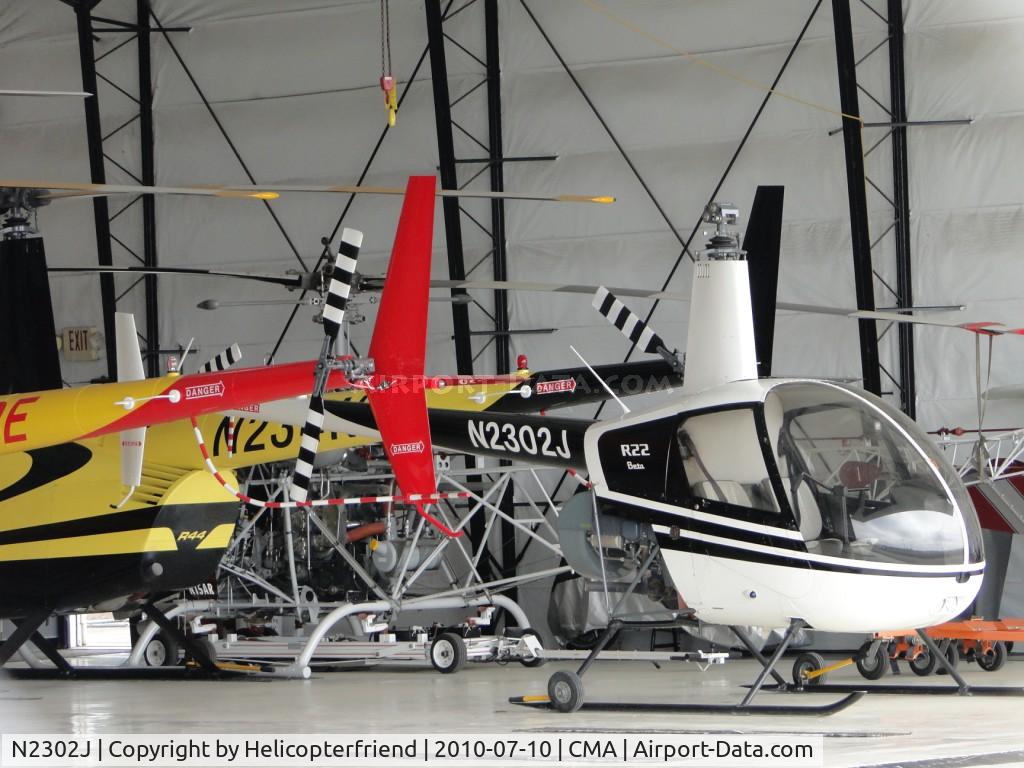 N2302J, 1946 Robinson R22 Beta C/N 1946, Parked in a hanger with a group of Robinson Helicopters