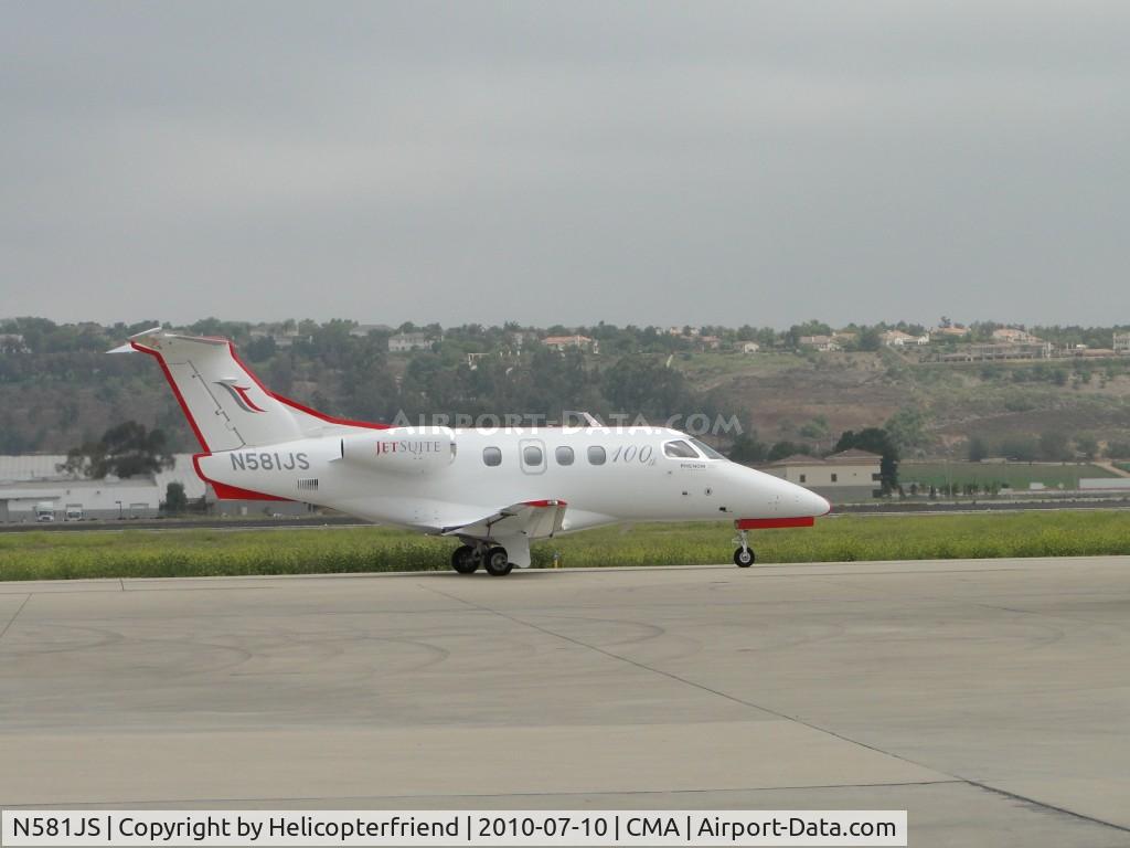 N581JS, 2009 Embraer EMB-500 Phenom 100 C/N 50000110, Taxiing east to runway 26 for take off
