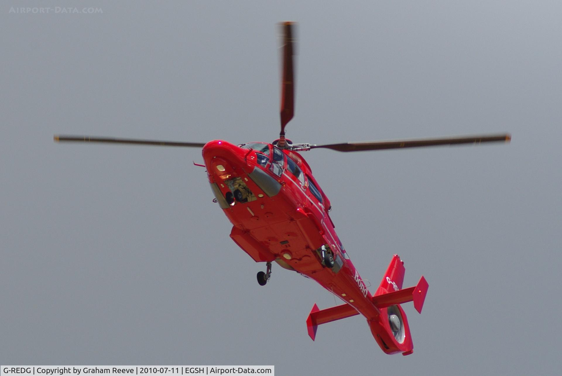 G-REDG, 2010 Eurocopter AS-365N-3 Dauphin 2 C/N 6907, Over flying Norwich Airport.