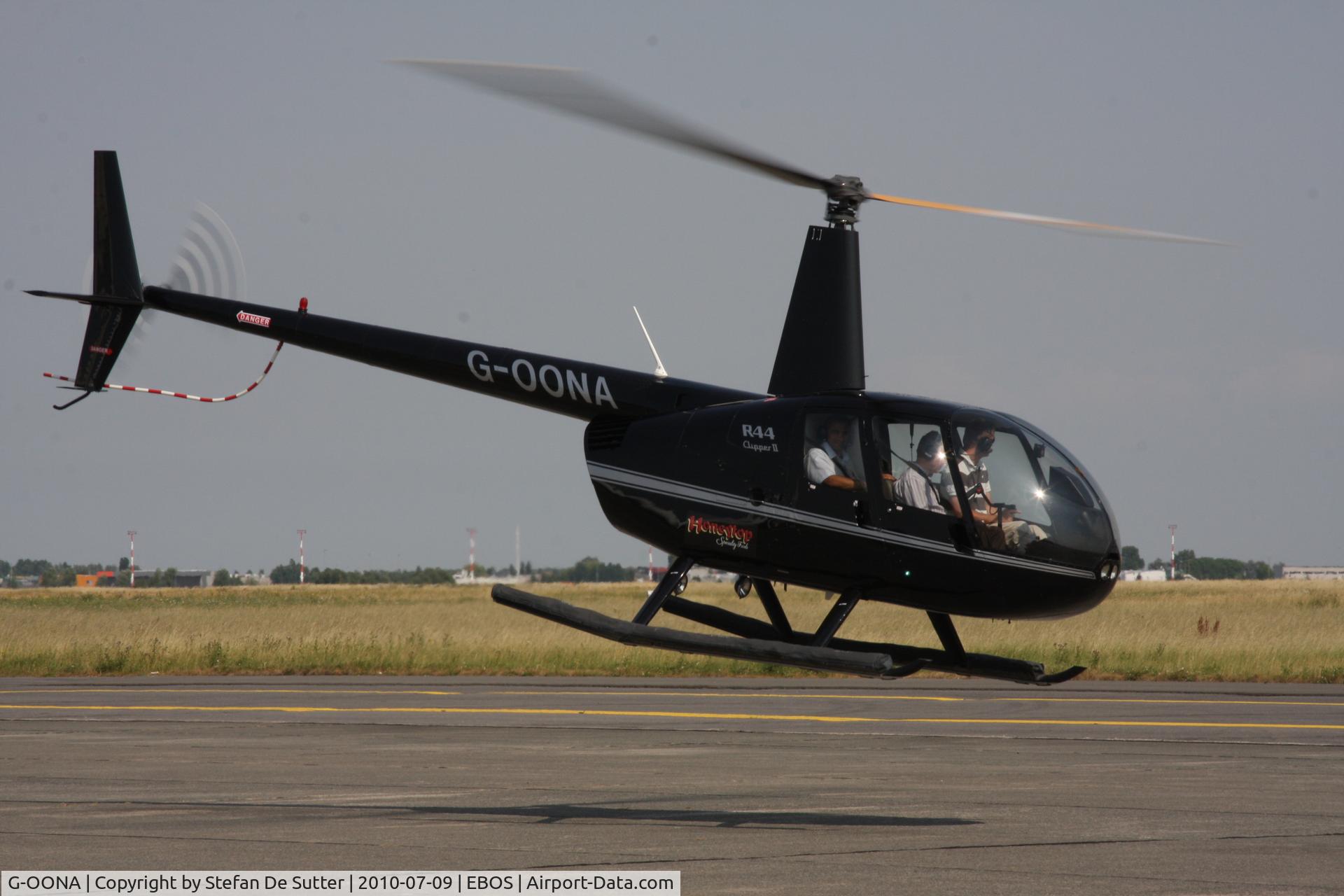 G-OONA, 2005 Robinson R44 Clipper II C/N 10907, Just lifting off of apron 3.