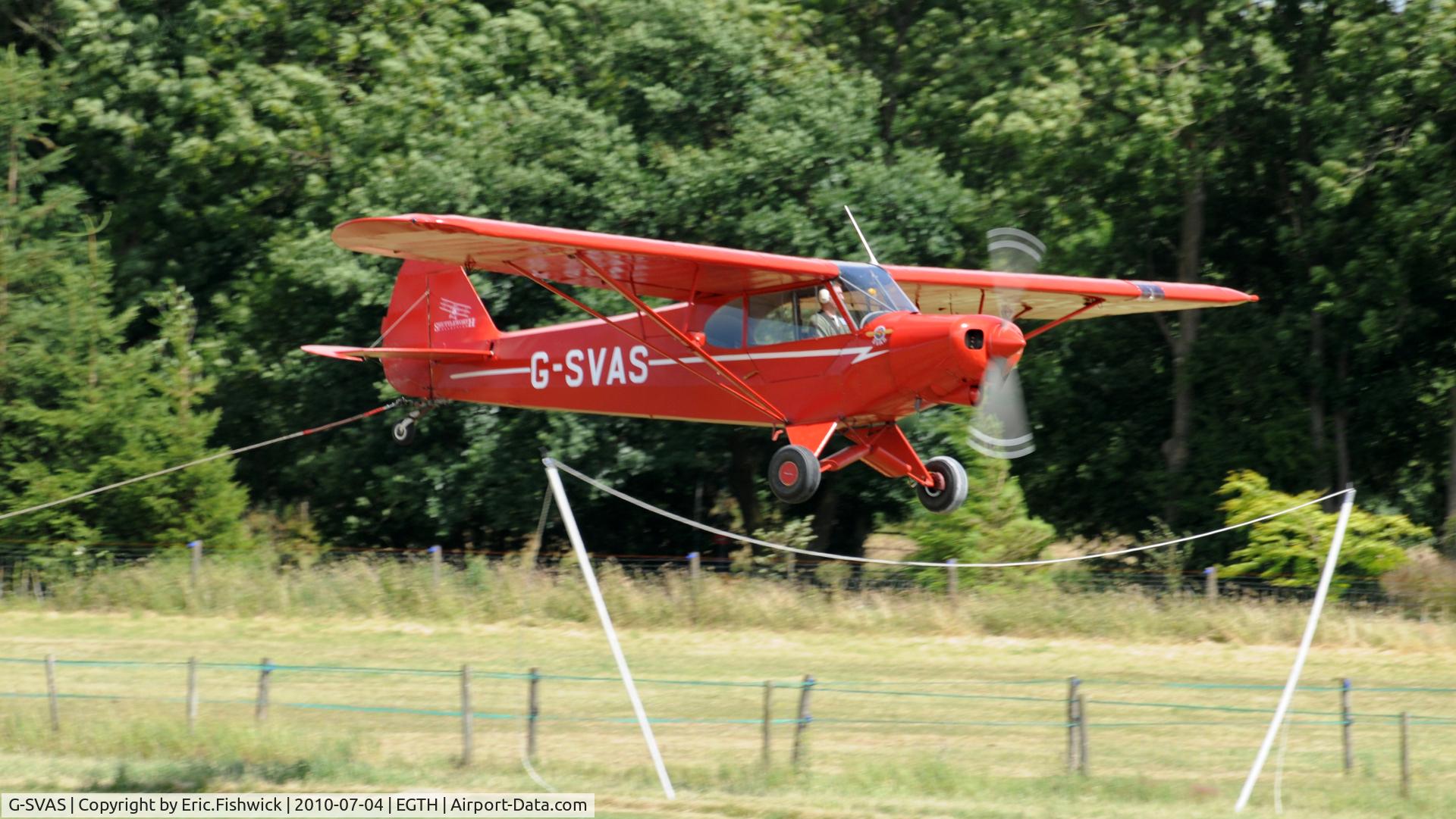 G-SVAS, 1961 Piper PA-18-150 Super Cub C/N 18-7605, 4. G-SVAS about to pick up the banner to display to the crowd at the Shuttleworth Military Pagent air Display July 10