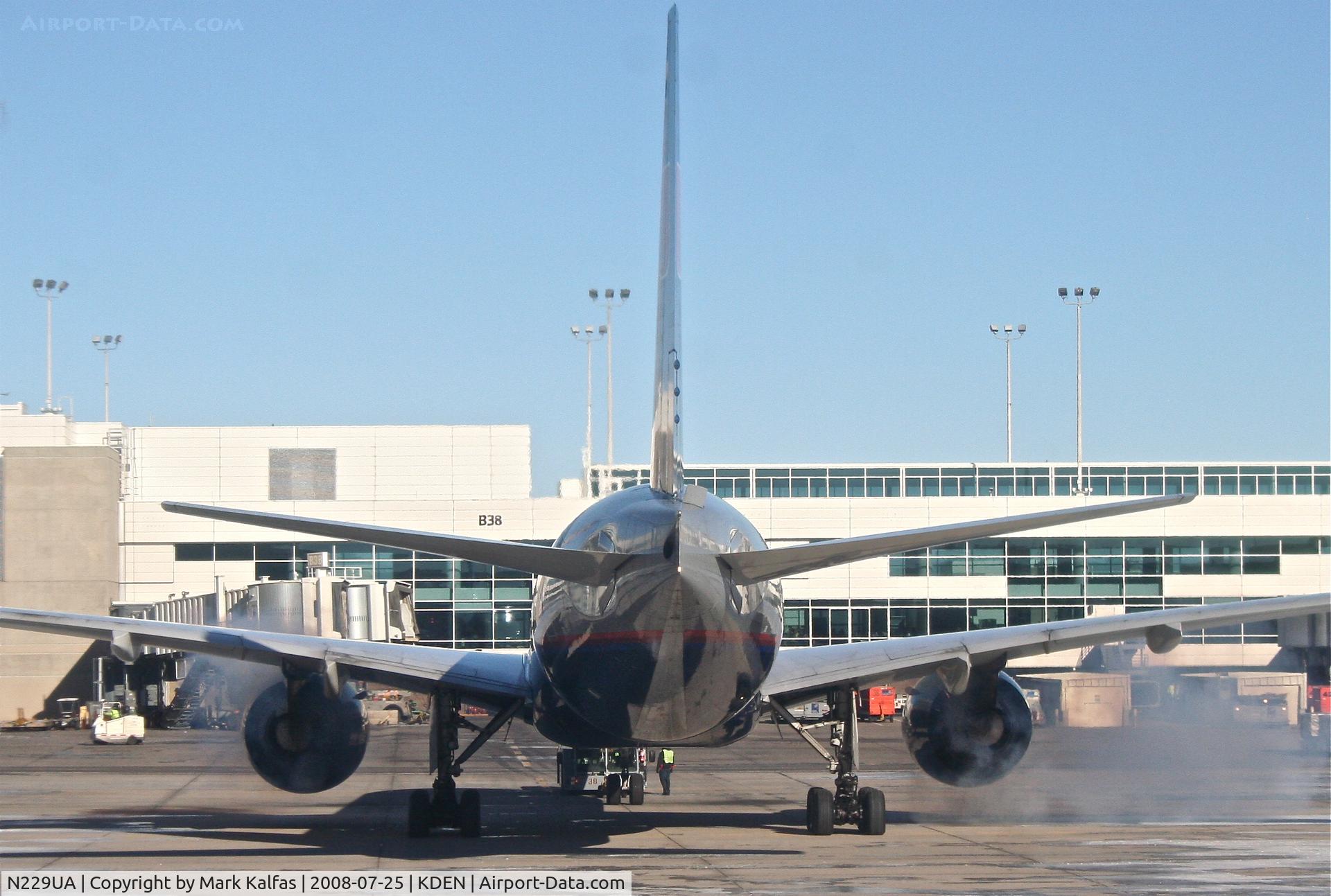 N229UA, 2002 Boeing 777-222 C/N 30557, United Airlines Boeing 777-222, N229UA pushing back and starting up from B38 KDEN.