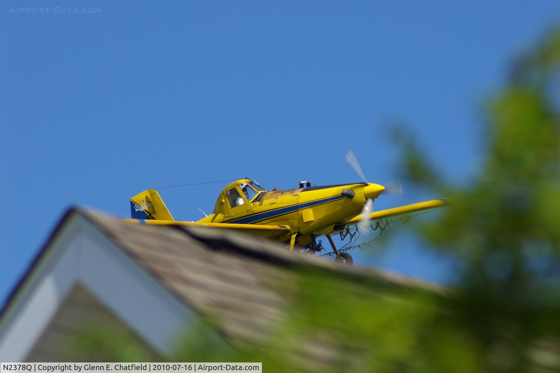 N2378Q, 1982 Air Tractor Inc AT-301 C/N 301-0454, Working the field just west of my neighborhood.  Now watching from my front yard in North Liberty Iowa.  That's my next door neighbor's house