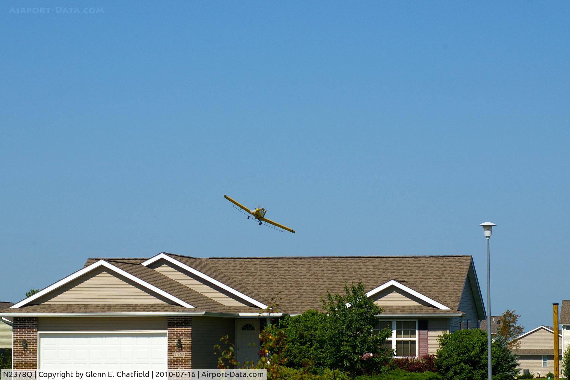 N2378Q, 1982 Air Tractor Inc AT-301 C/N 301-0454, Working the field just west of my neighborhood.  Now watching from my front yard in North Liberty Iowa.