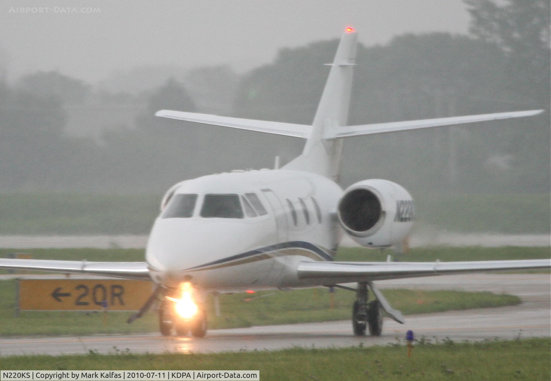 N220KS, 1984 Dassault Falcon 10 C/N 71, T M D F LLC Dassault-breguet FALCON 10, on taxiway W6 KDPA after arriving in heavy showers.